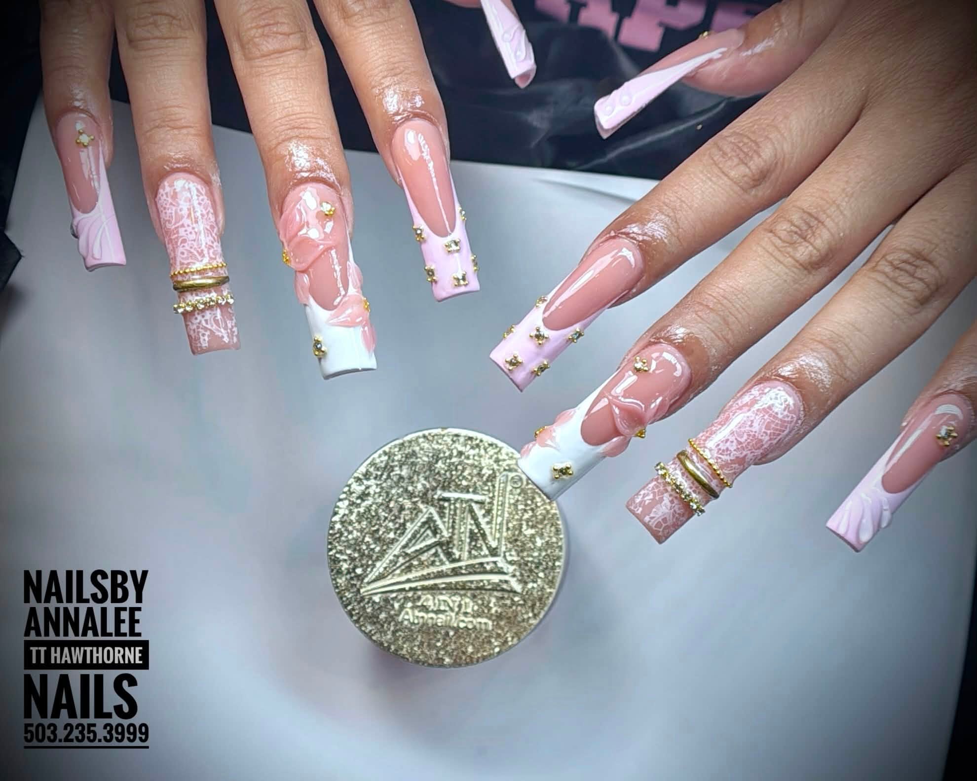 Pink and white nail art with gold accents and raised floral details by Le Nguyen at TT Hawthorne Nails, photographed with an ATN jar.